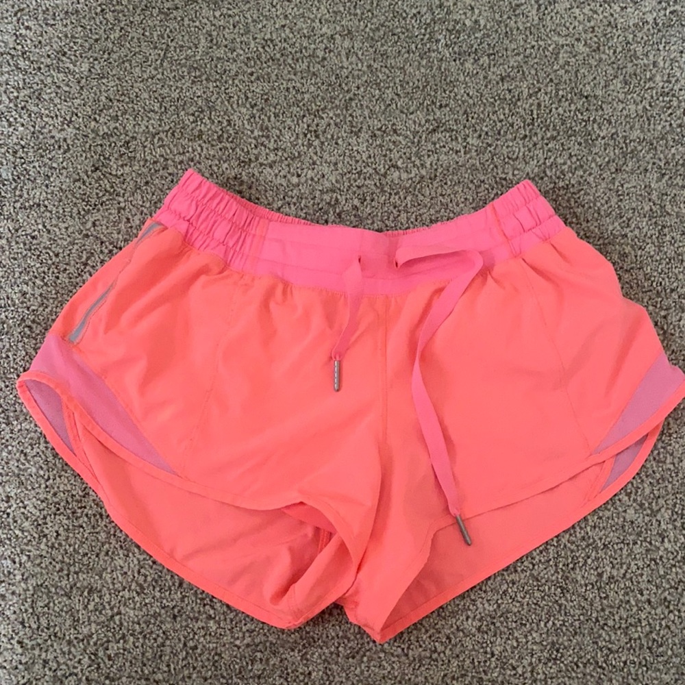 Lululemon bright orange running shorts
